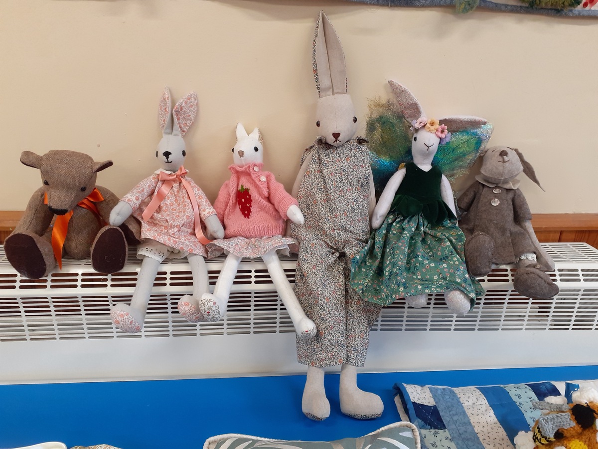 Sue has crafted a wonderful family of bunnies with a memory bear. They look so contented together.